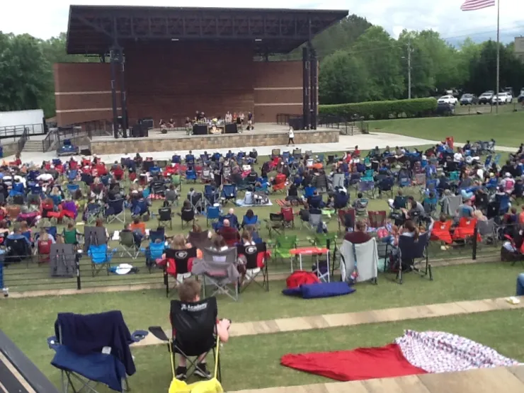 Outdoor amphitheater concert with audience